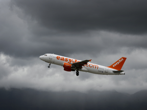 FILE: An Airbus plane of British low cost airline EasyJet takes off under heavy clouds on May 19, 2015 in Geneva.