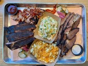 A platter of barbecued meats including pork ribs and pulled pork on the left, plus slices of brisket on the right, made by Meatings Barbecue. For 0603 dining. Peter Hum/POSTMEDIA