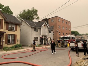Emergency services respond to a house fire at 46-48 Russell St. in Kingston on the morning of June 6, 2023.
