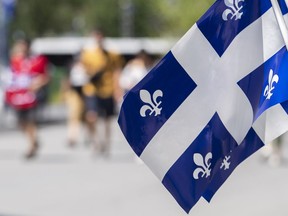 Quebec flags at a walk-through installation in Montreal.