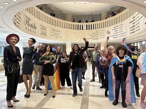Demonstrators protest outside the Florida House chambers against bills the chamber passed on gender-transition treatments, bathroom use and keeping children out of drag shows, Wednesday April 19, 2023 in Tallahassee, Fla.
