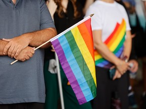 Man holds Pride flag