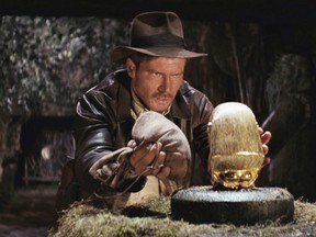 Harrison Ford as Indiana Jones, stealing a valuable relic of indigenous people in the opening scene of Raiders of the Lost Ark, the film that started the franchise.