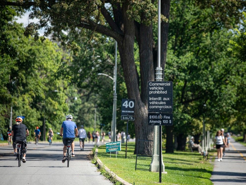 OTTAWA:  Runners, walkers and cyclists were out along the Rideau Canal on both the pathway as well as Queen Elizabeth Driveway that flows right beside, Saturday, July 22, 2023. 