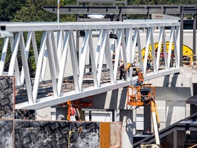 Crews were working Sunday, July 30, 2023, on the new pedestrian overpass that will go over Highway 417 near Pinecrest.