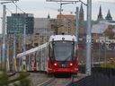 A file photo of an LRT car on a curved section of the Confederation Line in Ottawa.