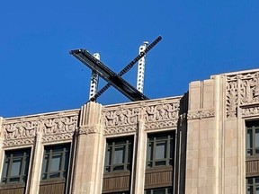 The new X sign is installed on the roof of the headquarters of Twitter