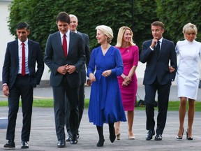 Prime Minister Justin Trudeau walks with other leaders and their spouses at the presidential palace in Vilnius, Lithuania, during a NATO Summit, July 11, 2023.