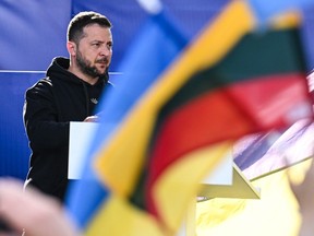 The President of Ukraine, Volodymyr Zelenskyy stands on the stage during the Raising the Flag for Ukraine NATO event on July 11, 2023 in Vilnius, Lithuania.