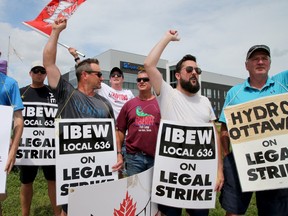 A small group of Ottawa Hydro picketers held signs and encouraged honks from traffic in front of the Ottawa Hydro headquarters