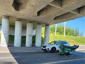The southbound lanes of Merivale Road between Colonnade Road and Roydon Place were temporarily closed to traffic Wednesday morning after a truck hit the train overpass. Tony Caldwell / POSTMEDIA