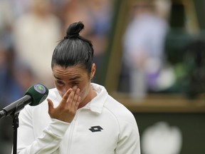 Tunisia's Ons Jabeur speaks after losing to Czech Republic's Marketa Vondrousova in the women's singles final on day thirteen of the Wimbledon tennis championships in London, Saturday, July 15, 2023.