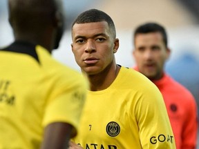 Paris Saint-Germain's French forward Kylian Mbappe looks on as he warms up before the French L1 football match between AJ Auxerre and Paris Saint-Germain (PSG) at Stade de l'Abbe-Deschamps in Auxerre, central France, on May 21, 2023.