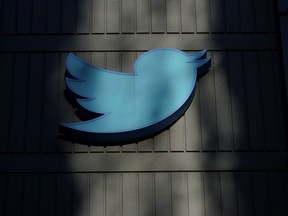 FILE - A sign at Twitter headquarters is shown in San Francisco on Nov. 18, 2022.
