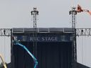 Crews tear down the stages at Ottawa Bluesfest Monday morning at Lebreton Flats. Over 300,000 people are believed to have attended Bluesfest this year. 