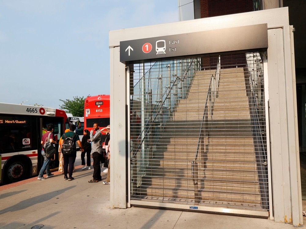 OTTAWA - July 18, 2023 - People catching  a bus at Hurdman Station in Ottawa. The LRT has been shut down by the city due to some safety issues.  