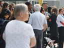 July 18, 2023 - People lining up to catch a bus at Hurdman Station in Ottawa Tuesday.