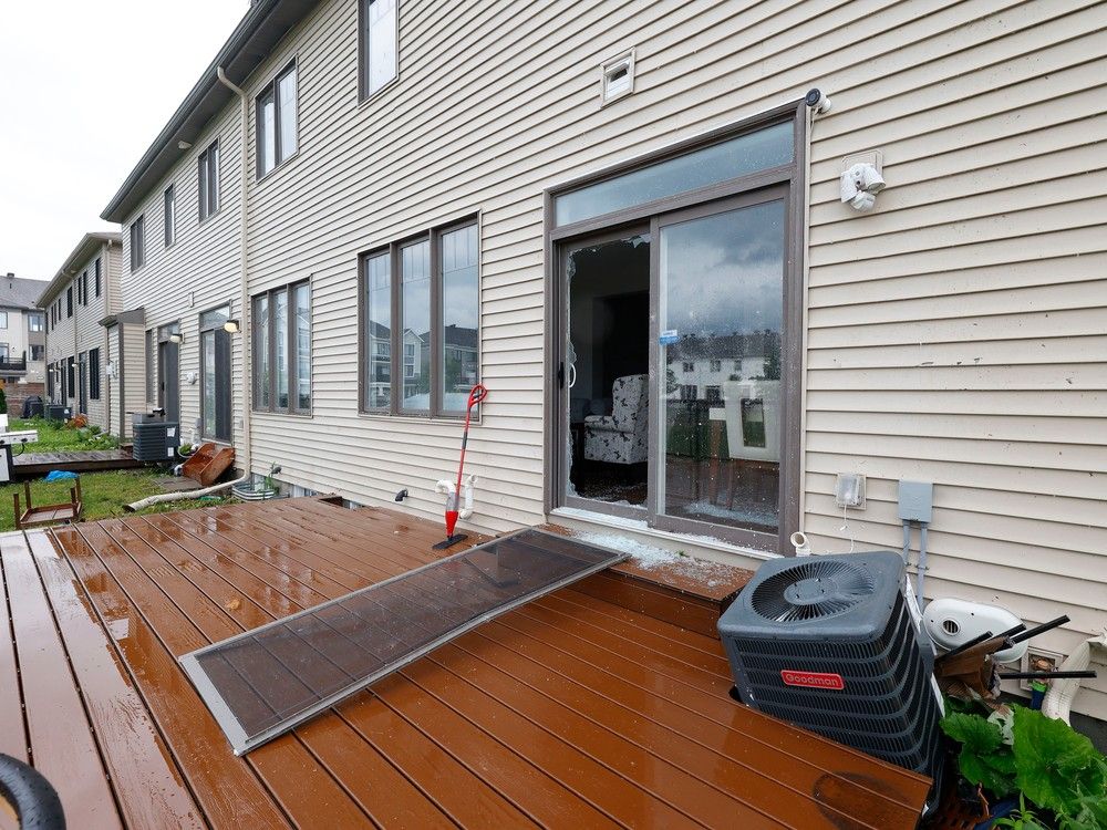 Families go outside their home to check out the damage to their homes and neighbourhood after a tornado rips through Barrhaven