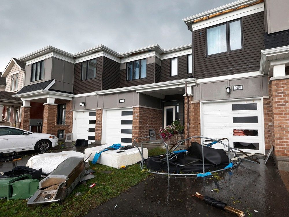 Families go outside their home near Merak Park