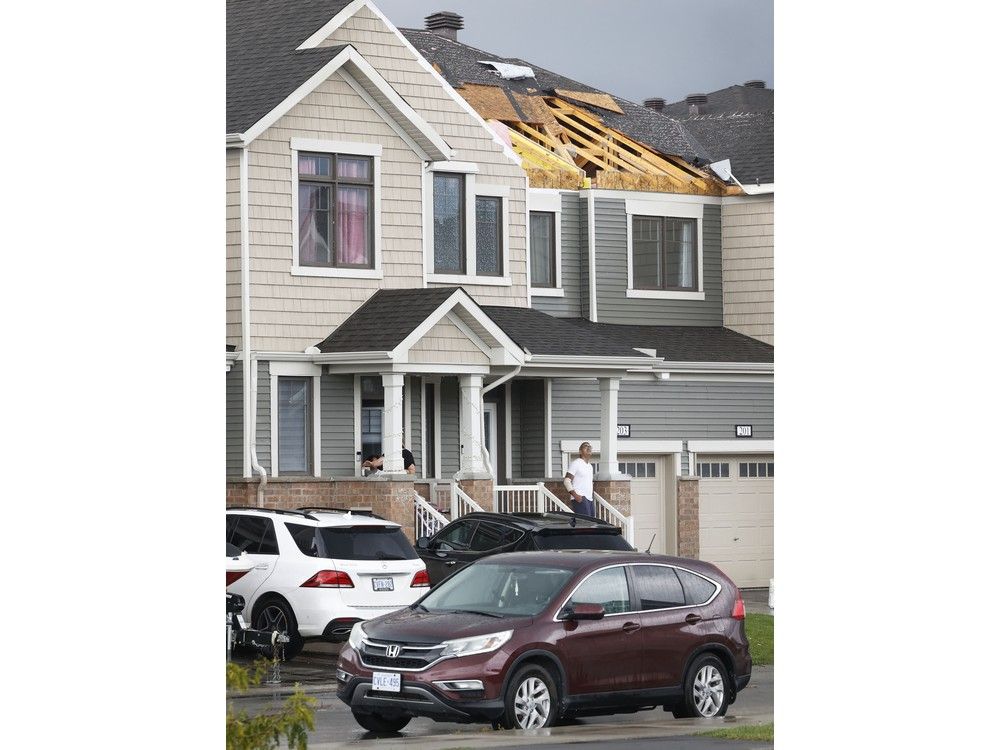 Families go outside their home near Merak Park