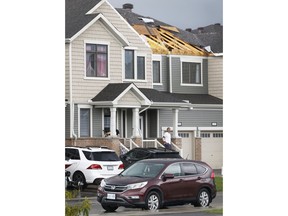 Families go outside their home near Merak Park