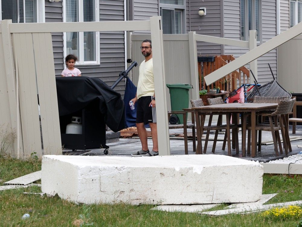 Families go outside their home near Merak Park