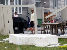 Families go outside their home near Merak Park