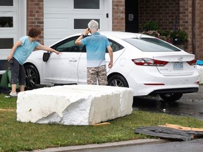 Families go outside their home near Merak Park