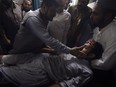 Patient and his family in a hospital in Peshawar, Pakistan