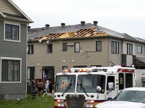 Homes are left damaged following a tornado in the Ottawa suburb of Barrhaven on Thursday, July 13, 2023.