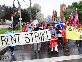 Hundreds of tenants and community members marched down Weston Road to protest rent increases at 33 King St. and 22 John St. in Toronto on July 15.