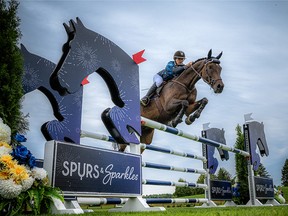 Karen Sparks, co-chair of Spurs & Sparkles and executive director of Wesley Clover Parks, flew over the oxer jump at the second Spurs & Sparkles Monday evening.