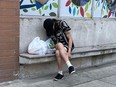 A drug user outside the South Riverdale Community Health Centre in Leslieville, Toronto.