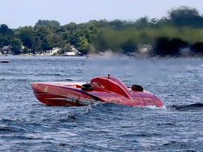 Heat can be seen rising from the powerful engines at the stern of the popular powerboat My Way as it makes its way to Brockville's Three Sisters islands Saturday afternoon during the 1000 Islands Poker Run. (RONALD ZAJAC/The Recorder and Times)