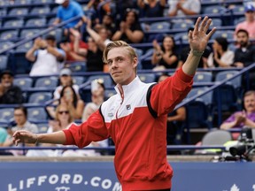 Canada's Denis Shapovalov walks onto the court to receive his championship ring during a ceremony honouring Canada's Davis Cup championship team at Day 1 of the National Bank Open in Toronto, Monday, Aug. 7, 2023. Shapovalov is one of four players that has been named to Canada's Davis Cup team for the international tennis competition's upcoming group stage.