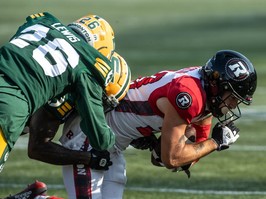 Redblacks being tackled