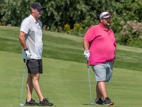 Brothers Nic (left) and Domenic Vidoni took the first-round lead at the Ottawa Sun Scramble's GolfWorks A Division Tuesday at eQuinelle Golf Club, shooting an 11-under 61. Domenic had a hole-in-one on No. 16. AL LETOURNEAU/A@E EVENT CAPTURES