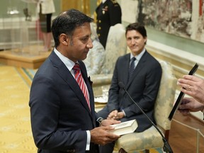 Justice Minister and Attorney General of Canada Arif Virani takes the oath of office as Prime Minister Justin Trudeau watches during a cabinet swearing-in ceremony at Rideau Hall in Ottawa, July 26, 2023.