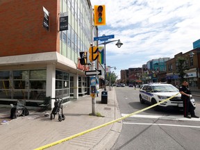 Ottawa police and paramedics were on the scene of a double stabbing at the corner of Bank Street and Gloucester Street on Monday.