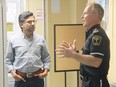 Ottawa Centre MP Yasir Naqvi, left, a candidate in the Ontario Liberal Party leadership race listens as Renfrew County Paramedic Service Cmdr. Curtis Farrell describes the region's innovative VTAC service.