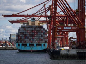 Cargo containers are unloaded at the Port of Vancouver in April.