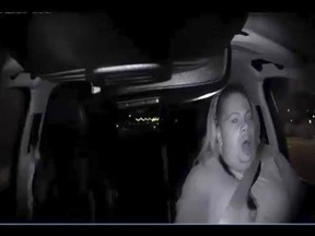 FILE - This March 18, 2018, file photo from video from a mounted camera provided by the Tempe Police Department shows an interior view moments before an Uber SUV hit a woman in Tempe, Ariz.