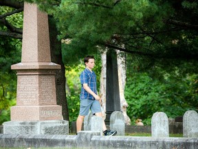 Dylan Cook, the 12-year-old son of Marguerite Hale's nephew, walked through the cemetery during Beechwood's Annual Historical Tour — A Walk through 150 Years — on Sunday.