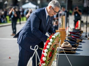 Tom Stamatakis, president of the Canadian Police Association laying a wreath at Canadian Police and Peace Officers' 46th annual memorial service on Parliament Hill