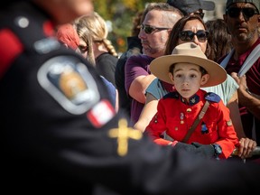 Seven-year-old Jacob Roush-Said was dressed in his RCMP outfit to watch the procession