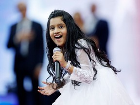 Pranysqa Mishra performs the national anthem prior to the opening night session during their Women/Men's Singles First Round matches on Day One of the 2023 US Open at the USTA Billie Jean King National Tennis Center on August 28, 2023.