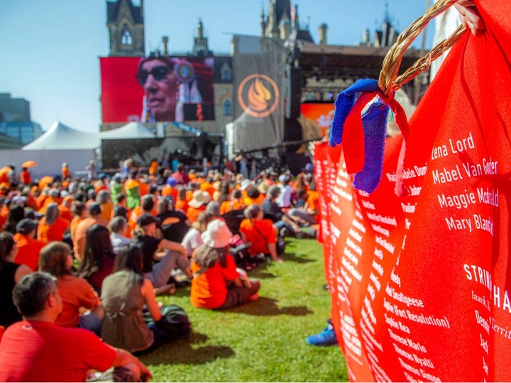  Parliament Hill was a sea of orange as a gathering was held to honour the National Day for Truth and Reconciliation on Saturday, September 30, 2023. A very long banner wrapped along the crowd of people that was filled with names of those killed in residential schools.