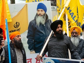 Approximately 200 people protest outside the Indian consulate in Vancouver on June 24, 2023, calling for an independent Sikh state within India called Kalistan. The protest zeroed in on the murder of Sikh independence leader Hardeep Singh Nijjar, pictured on the poster.