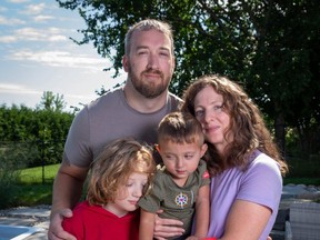 Greg Hanniman, rear, with sons, from left, Raylan and Aleksandar, and wife Marli Nicol in Arnprior, Ont., on Thursday, Aug. 31 2023.