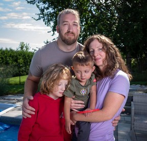 Greg Hanniman, rear, with sons, from left, Raylan and Aleksandar, and wife Marli Nicol in Arnprior, Ont., on Thursday, Aug. 31 2023.